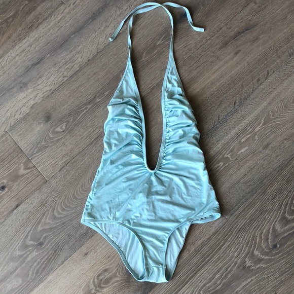 Never worn deep plunge one piece bathing suit M